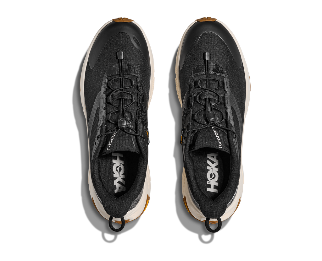 HOKA Transport 2 Hombre Black / Alabaster — vista medial