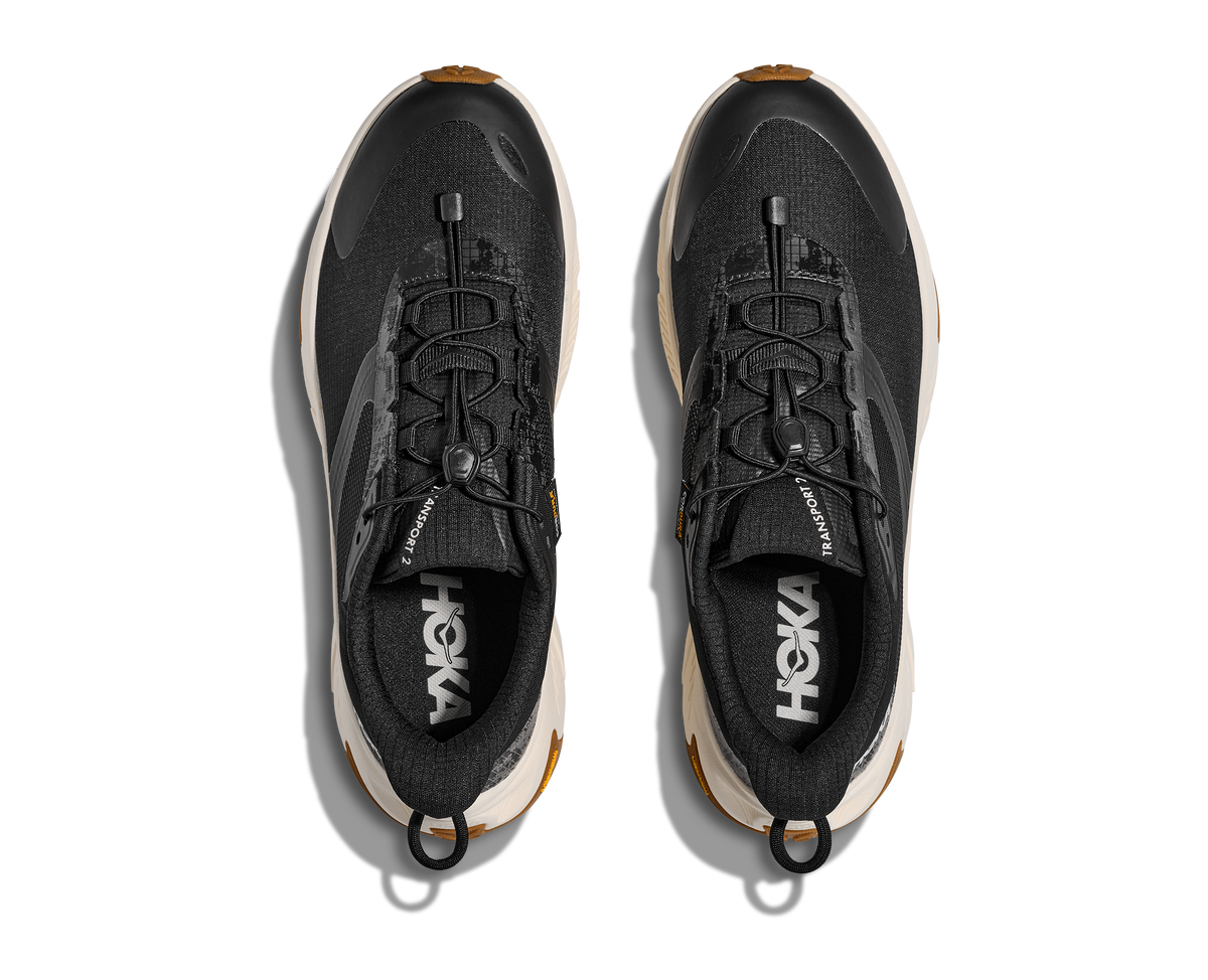 HOKA Transport 2 Hombre Black / Alabaster — vista medial