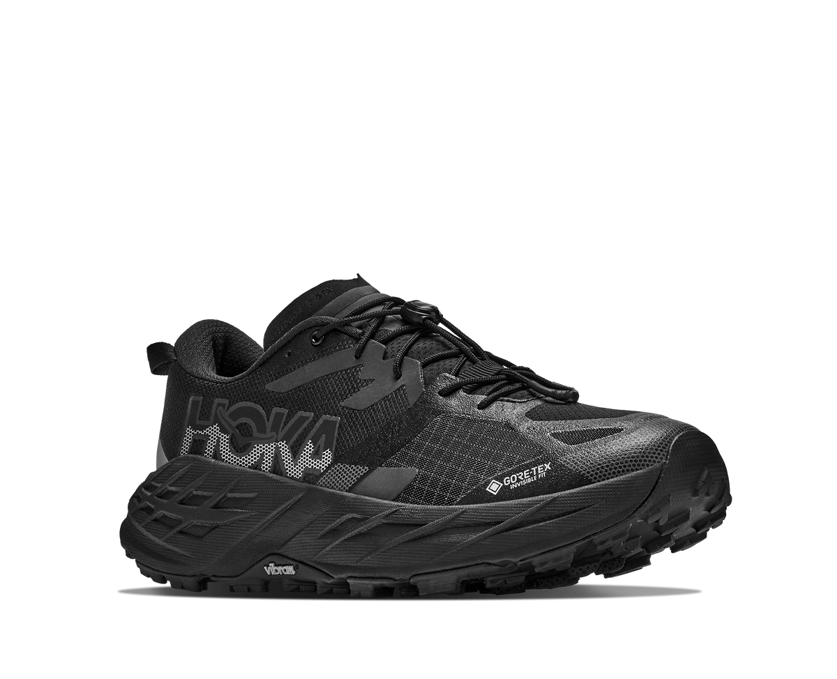 HOKA Speedgoat 7 GTX Hombre Black / Carbon Black — vista trasera
